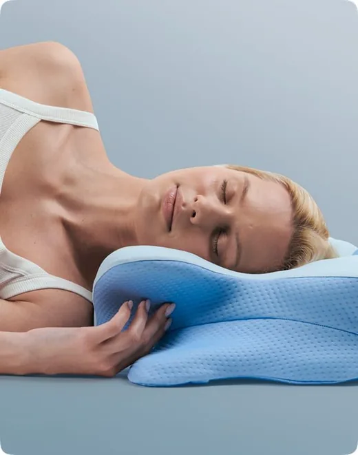 Person sleeping on their side on the pillow